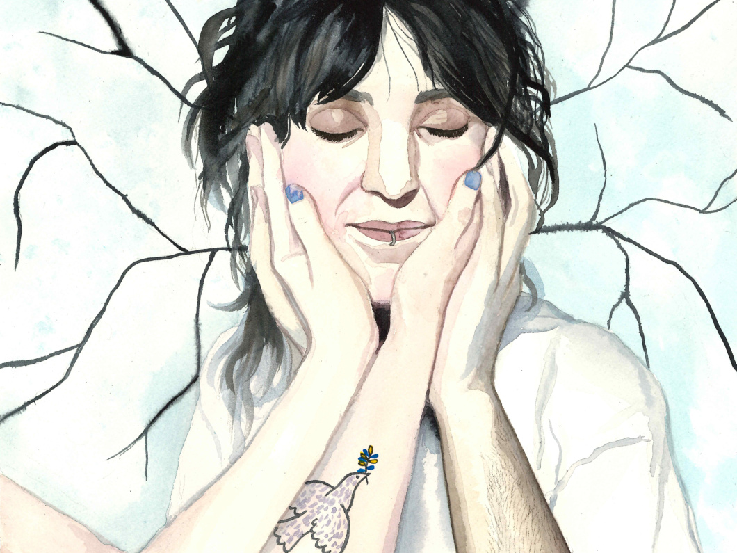 A watercolor portrait illustration of a dark haired person smiling with their eyes closed, being cradled by four hands. It is unclear who the hands belong to. On on of the arms, there is a tattoo of a dove of peace. Dark twigs branch out from the persons hair on the background.